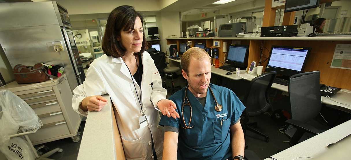 Emergency doctors reviewing charts