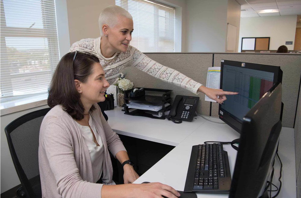 Researchers at a computer