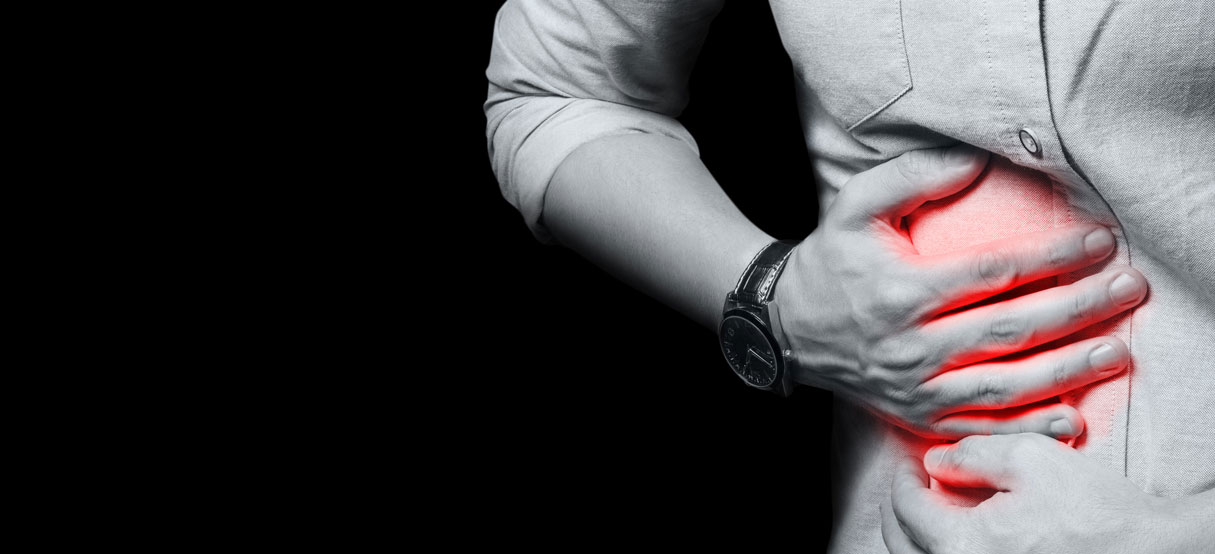 Person holding their side in pain