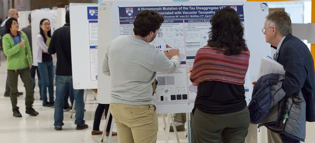 Researcher explaining a lab project to colleagues