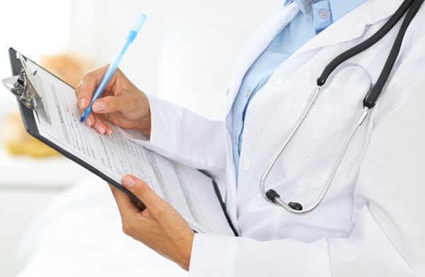 doctor filling out form