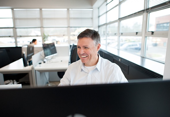 man sitting at desk