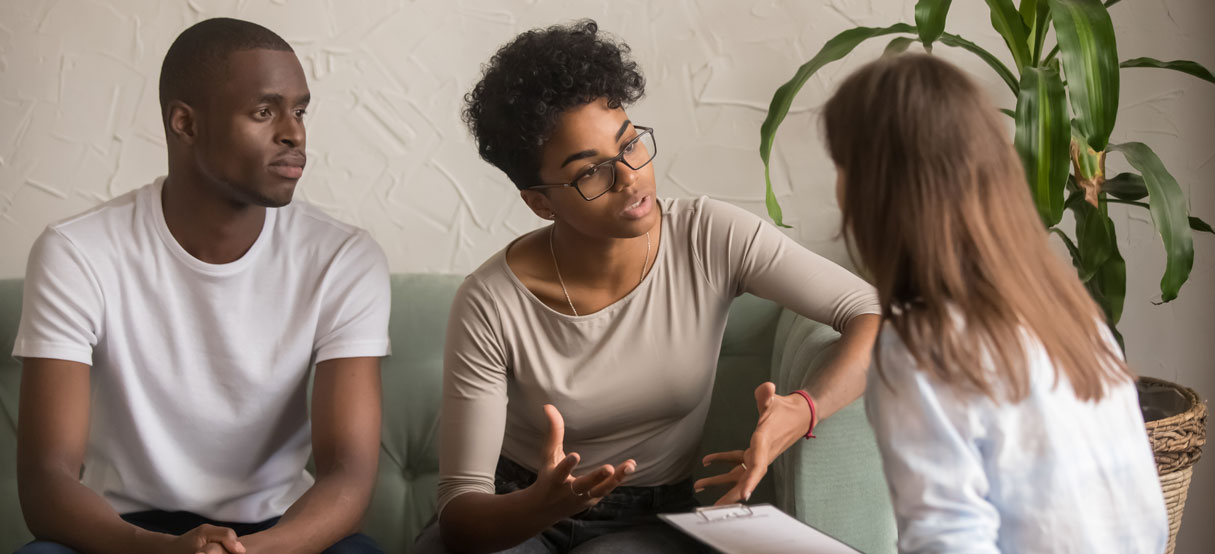 Couple talking with a doctor