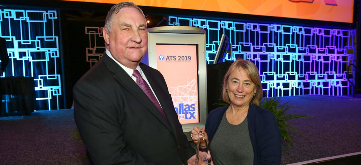 John Hansen-Flaschen receiving award