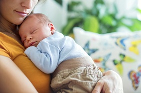 Woman with infant image