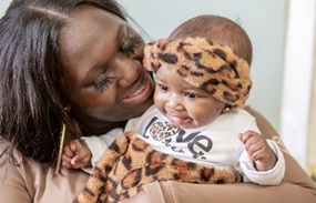 mother and daughter smiling
