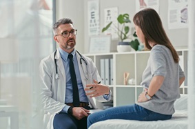 Physician counseling young patient