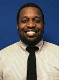 Head shot of Michael Sangobowale