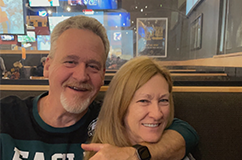 Jim and wife smiling