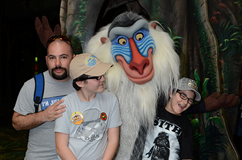 man with two kids and Goofy