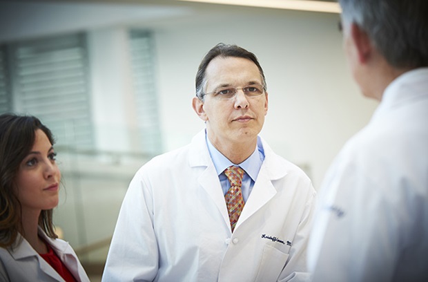 Bariatric surgeon Dr. Dumon talking to fellow physician and dietitian