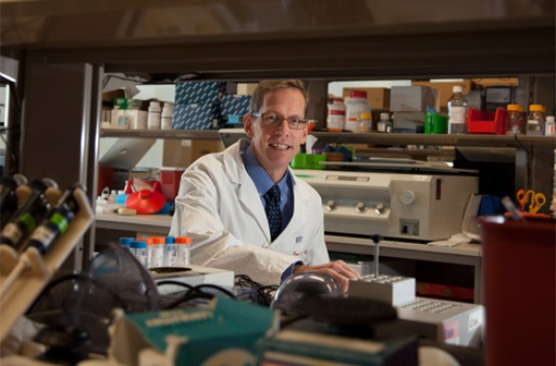 Dr. Vonderheide smiling in lab