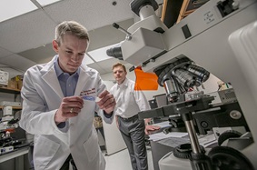 men in a lab