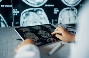 Clinician reviewing imaging on screen