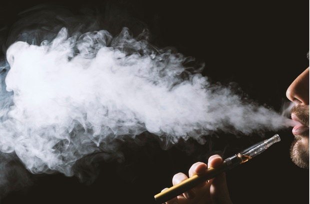 man using a vape cigarette