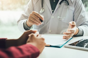 Physician and patient hands
