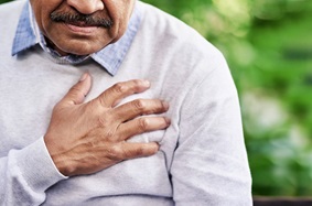 Elderly Man clutching chest