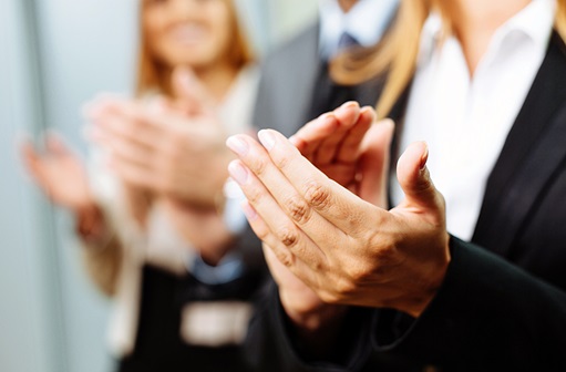 Close-up view of hands clapping