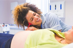 Nurse midwife with patient