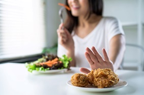 Woman Refusing Unhealthy Food
