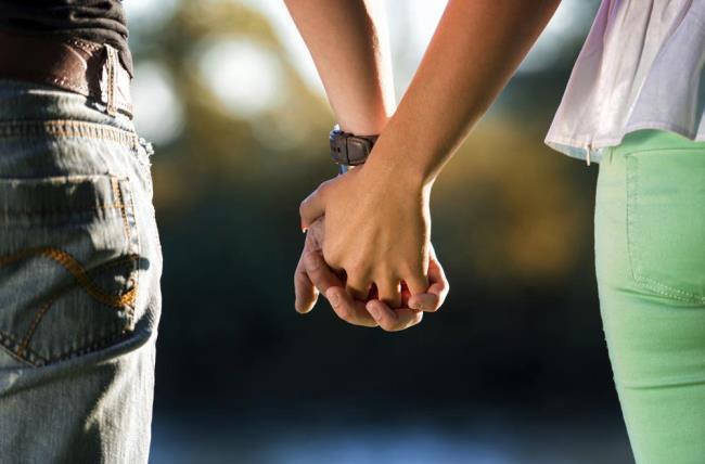 Couple holding hands