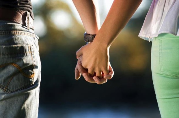 Couple holding hands