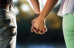 Couple holding hands