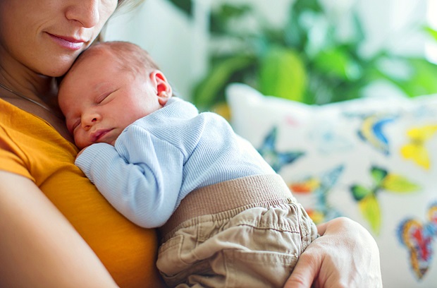 Mom holding newborn son