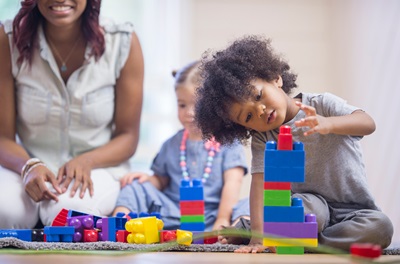 Toddler boy playing with blocks