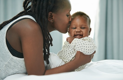 Woman Kissing Baby