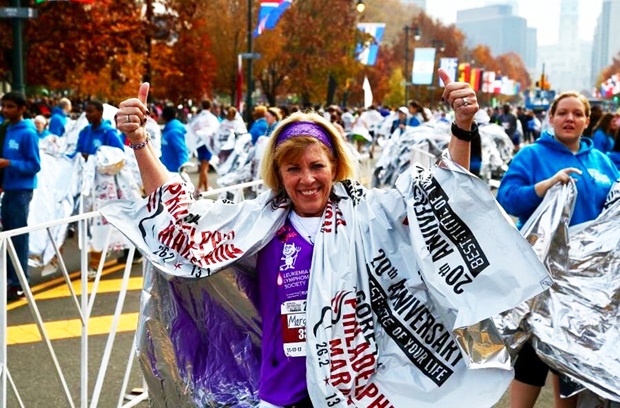Marge victorious running towards a cure