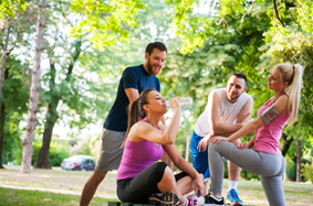 runners drinking and stretching