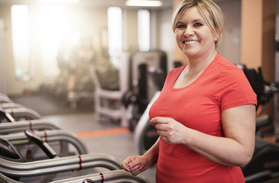 Woman walking on a treadmill