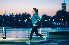 Woman running at night