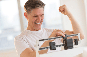 man celebrating on scale