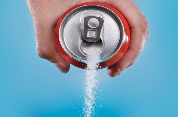 soda can with sugar pouring through it