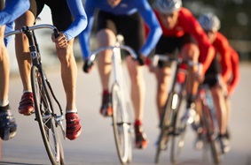 bikers in a race, all wearing red or blue