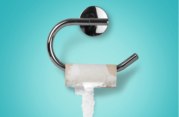 an_empty_roll_of_toilet_paper_hangs_on_hanger_in_bathroom_with_plain_light_blue_wall_as_background