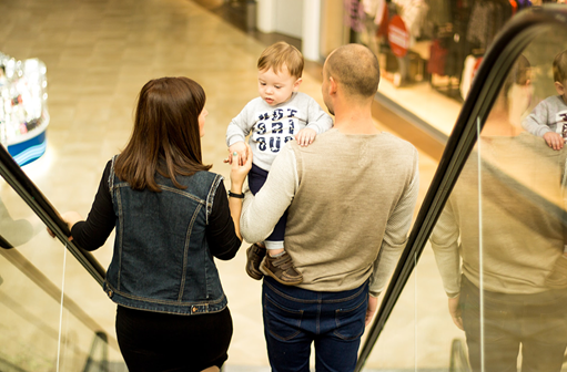 family on escalator