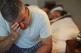 Man dealing with insomnia