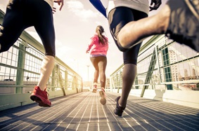 three people running together