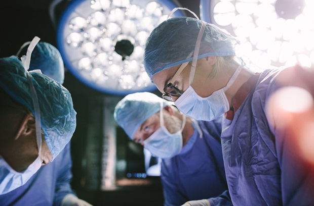 Multiple surgeons performing surgery