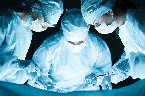 three surgeons operating