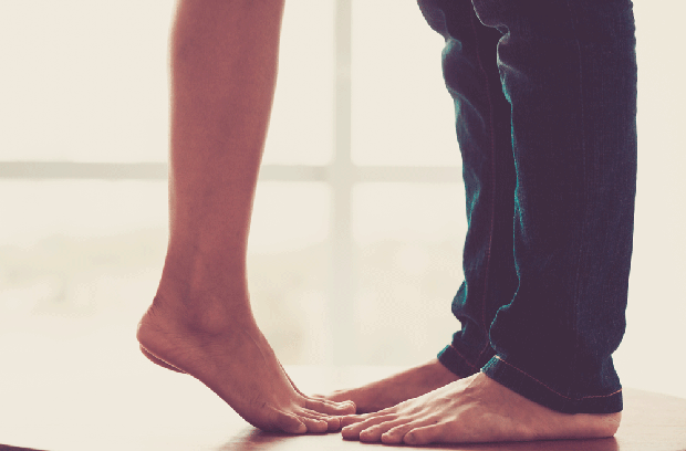 two pairs of feet and legs facing each other