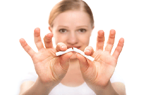 woman breaking cigarette