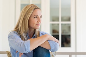 woman sitting and looking off into the distance
