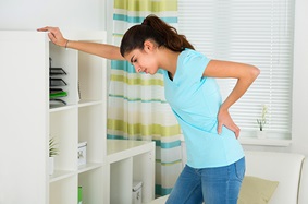 women holding lower back