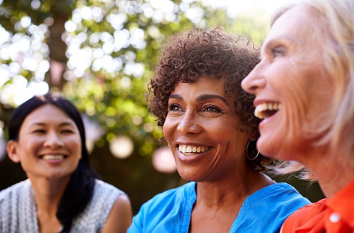 Middle Aged women laughing outdoors