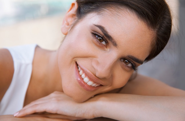 Smiling woman with head down