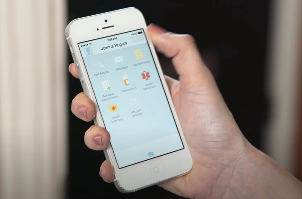 Hand holding a mobile phone with the myPennMedicine app